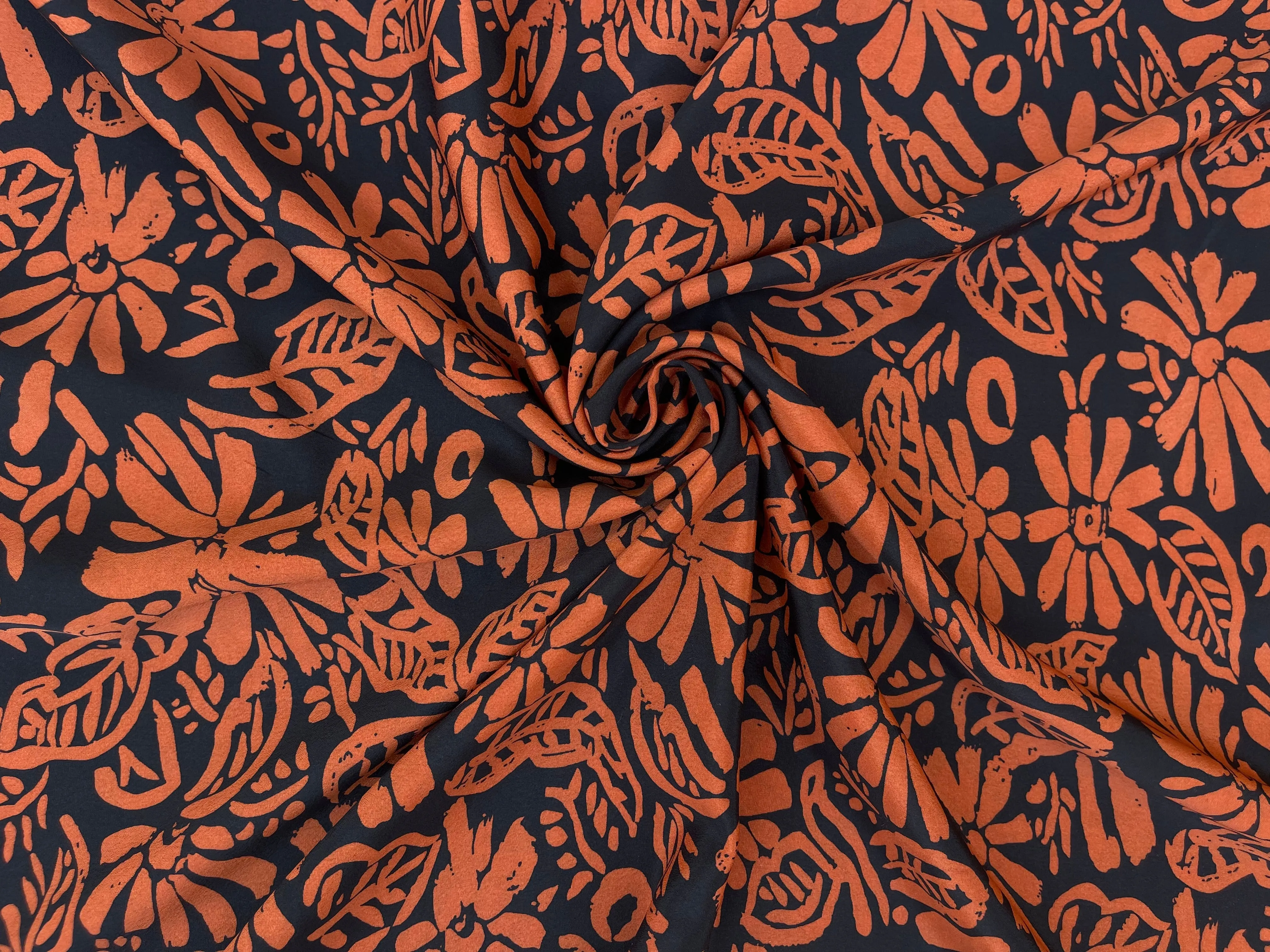 Crepe de Chine fabric by the yard - Orange paisley floral on black